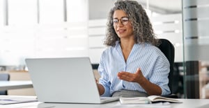 Woman working on computer at office 