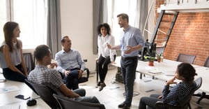 Group of employees in a corporate office having a meeting