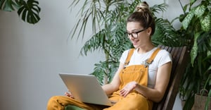 Employee running a wellness benefit audit on her computer remotely