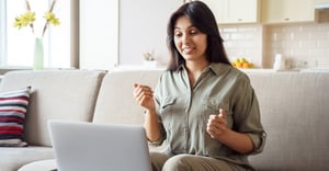 Woman working on her laptop at home