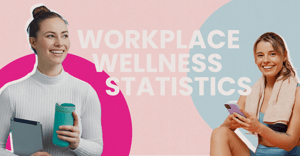 Two women smiling that their workplace wellness statistics are positive