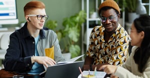 coworkers working in office