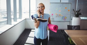 HR wellness trends woman employee working out at the office